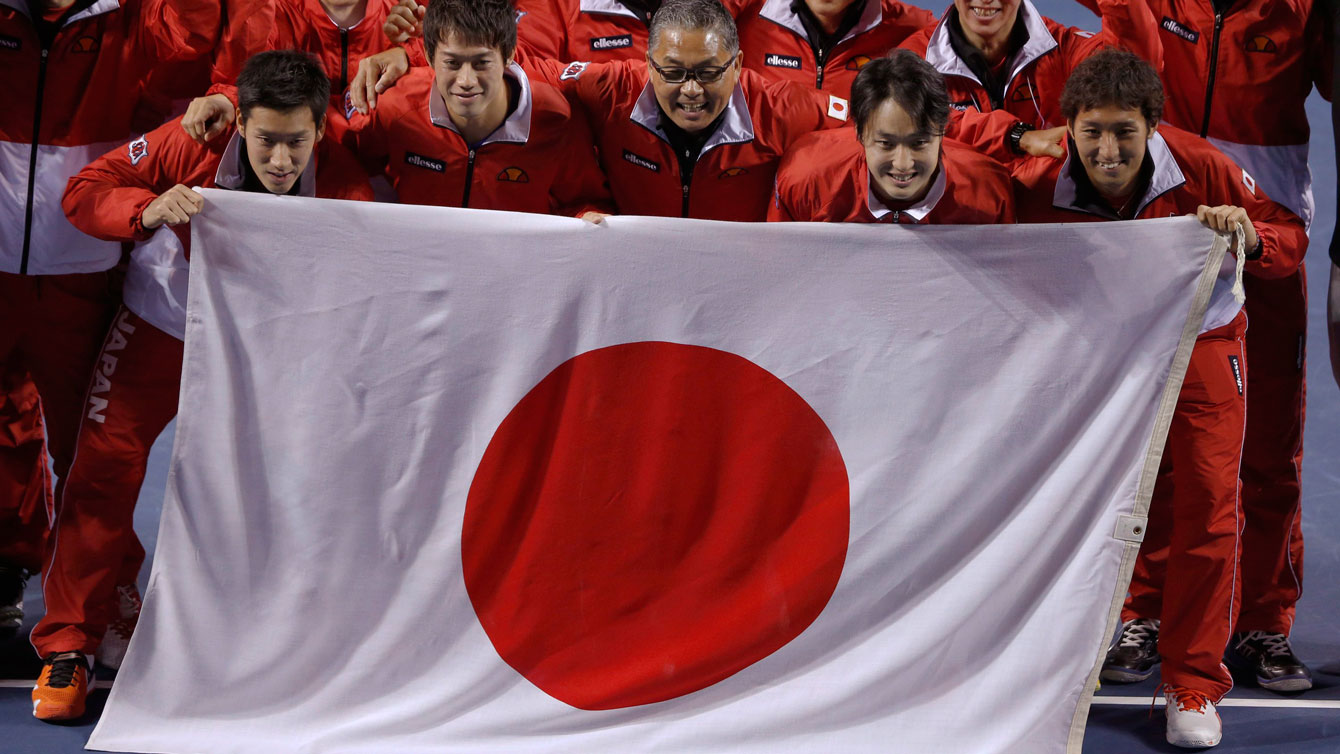 Japanese team poses with their flag following their defeat of Canada in the 2014 Davis Cup. 