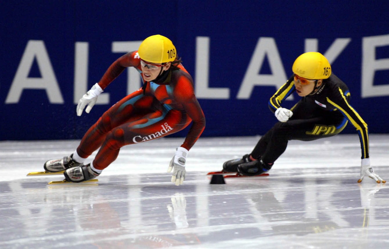 Canadian short track speed skater Isabelle Charest is followed closely by Japan's Chikage Tanaka during the Women's 500 metre, Feb. 16, at the 2002 Olympic Winter Games in Salt Lake City. (CP Photo/COC/Andre Forget).