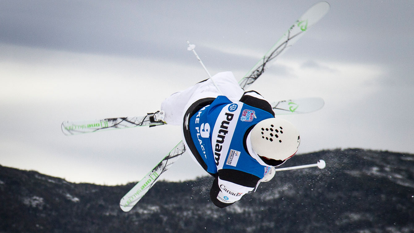Marc-Antoine Gagnon flies through the air at Moguls World Cup at Lake Placid. Photo: Evan Spinosa