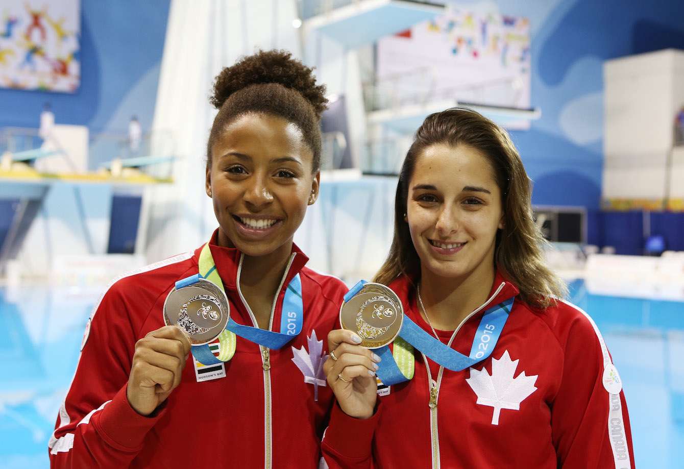 Jennifer Abel and Pamela Ware of Canada win Silver in the Women's 3m Synchro Final. Photo by Vaughn Ridley.