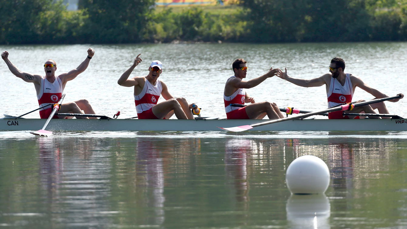 Conlin McCabe, Kai Langerfeld, Tim Schrijver and Will Crothers celebrate their Pan Am Games coxless four win on July 13, 2015