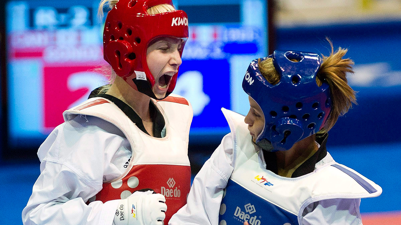 Ivett Gonda, left, screams after scoring a point in the women's gold medal Taekwondo final during the 2011 Pan Am Games
