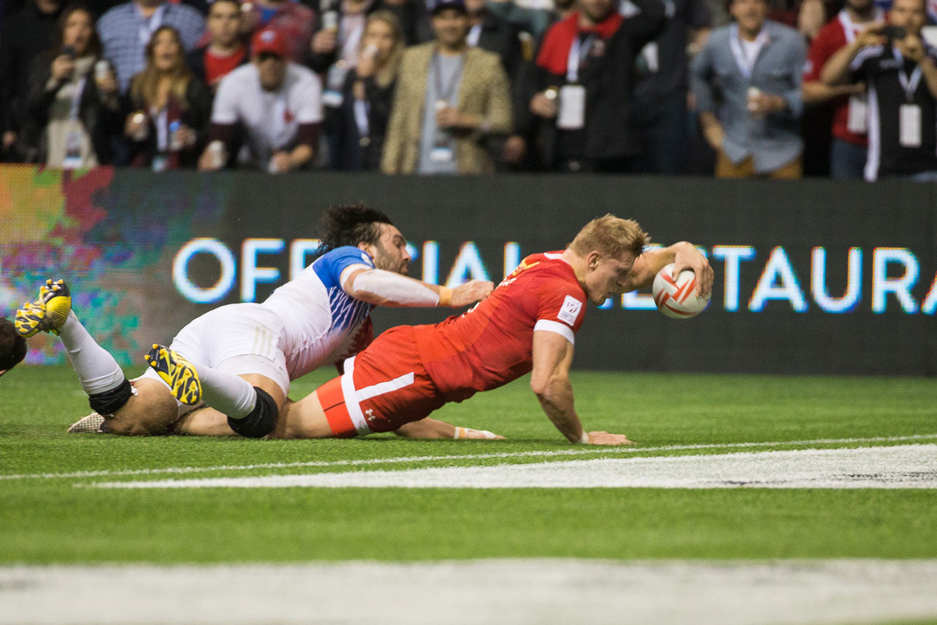 John Moonlight stretches to reach the try line, scoring the game winning try for Canada to beat France 19-17 in the bowl final (Photo: Derek Stevens via Rugby Canada).