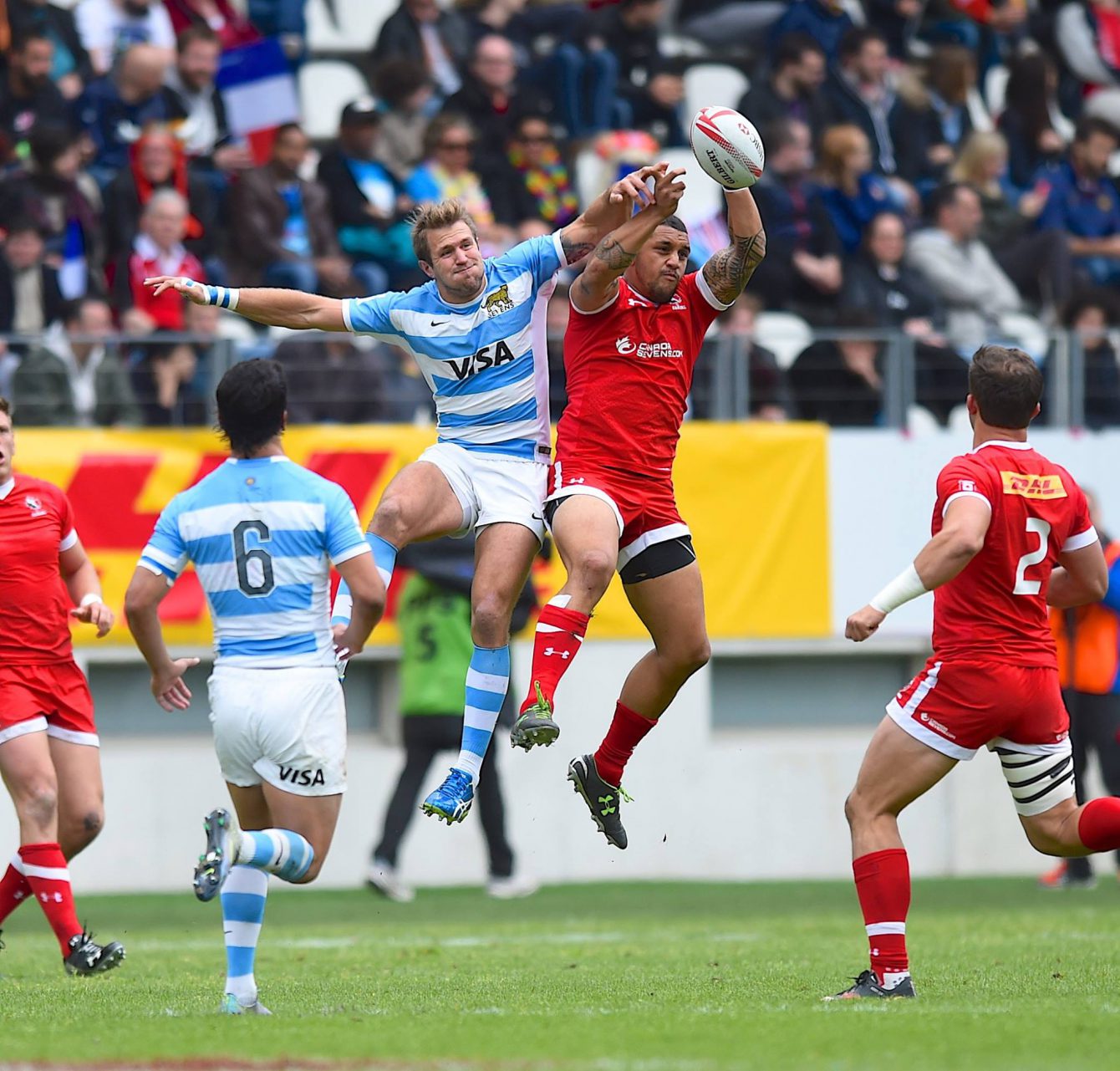 Mike Fuailefau gains possession for Canada in a match against Argentina at Paris Sevens 2016 (Photo: Rugby Canada).